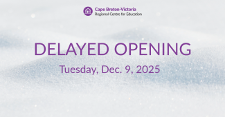  Purple text on snow-covered background. Text reads: “Delayed Opening. Tuesday, Dec. 9, 2025.”